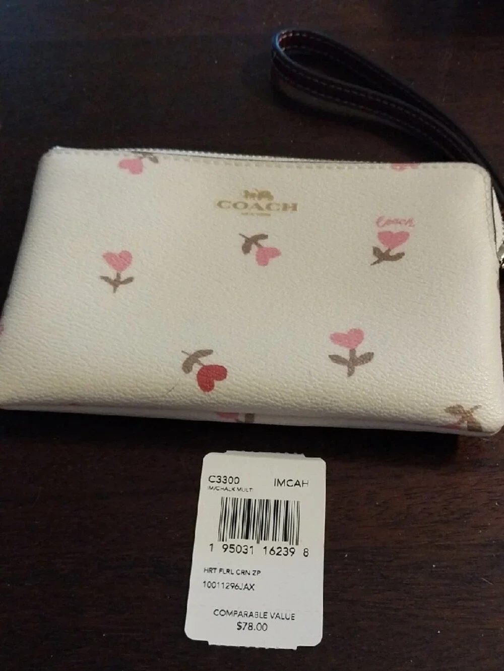 Coach Cream Wristlet with Pink Floral Accents and Brown Strap